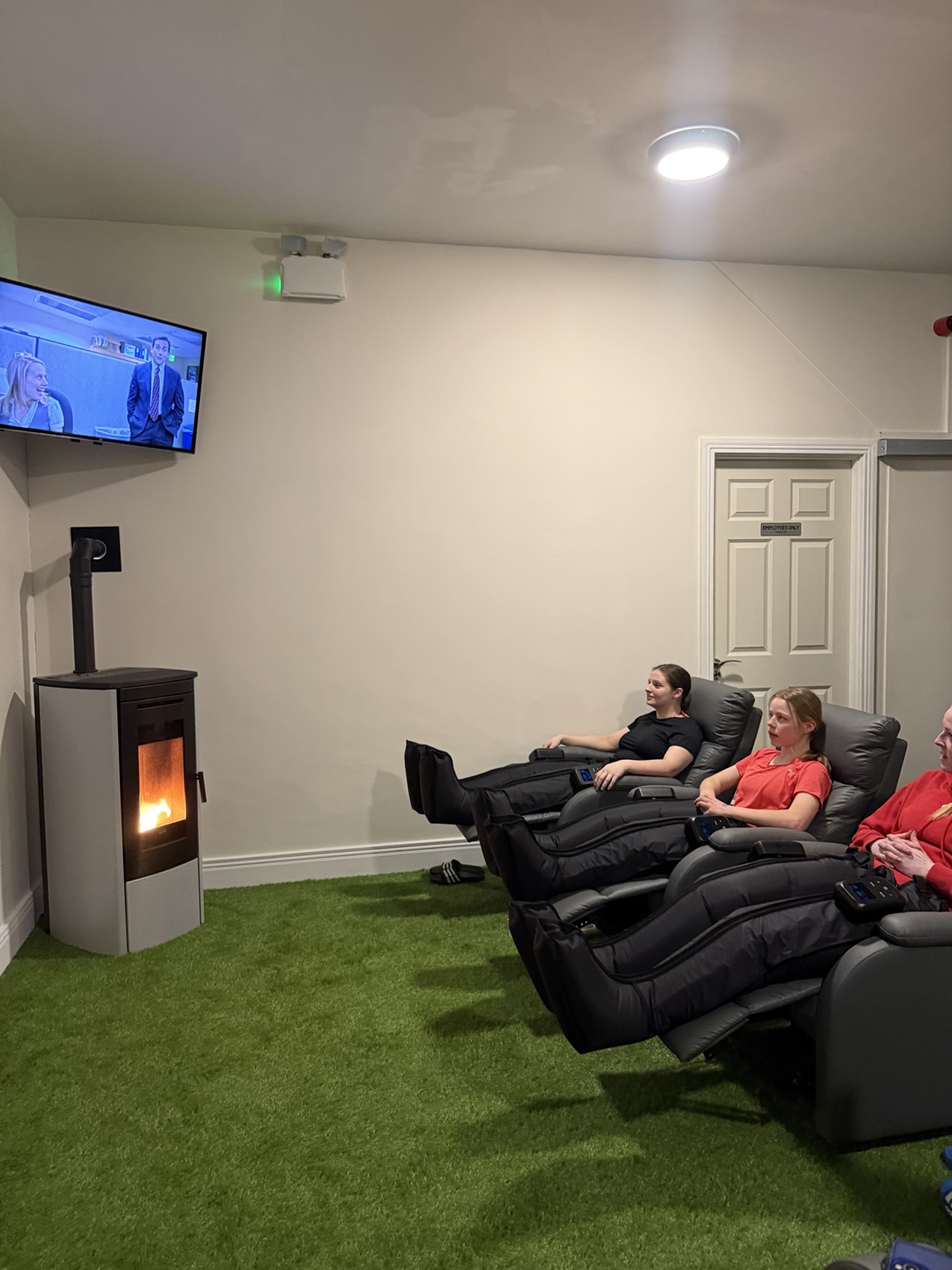 Customers relaxing in compression boots at Revibe